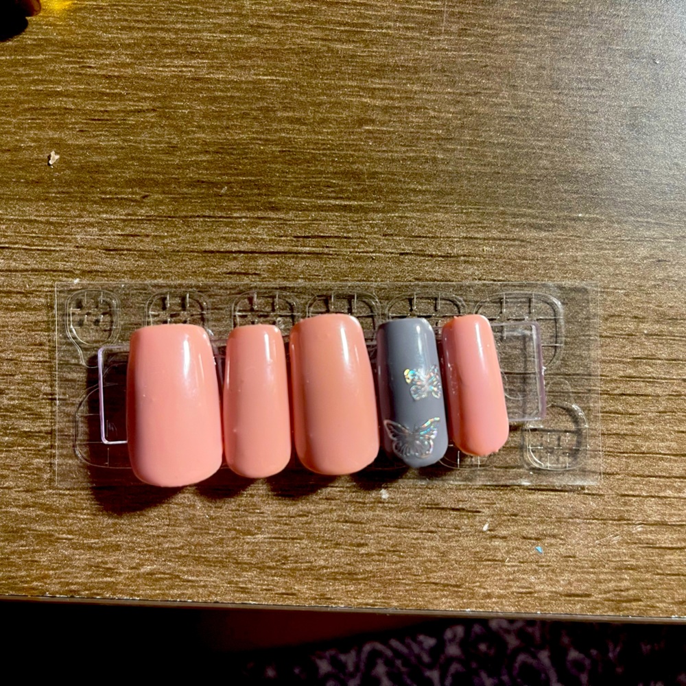 Pink nails with butterflies